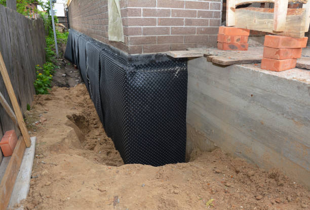 Happy homeowners after waterproofing job in Wolcott